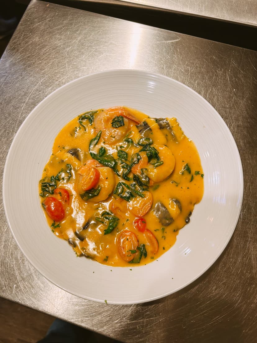 Fresh mozzarella cheese being prepared for Italian dishes at Mama Mia's Ristorante