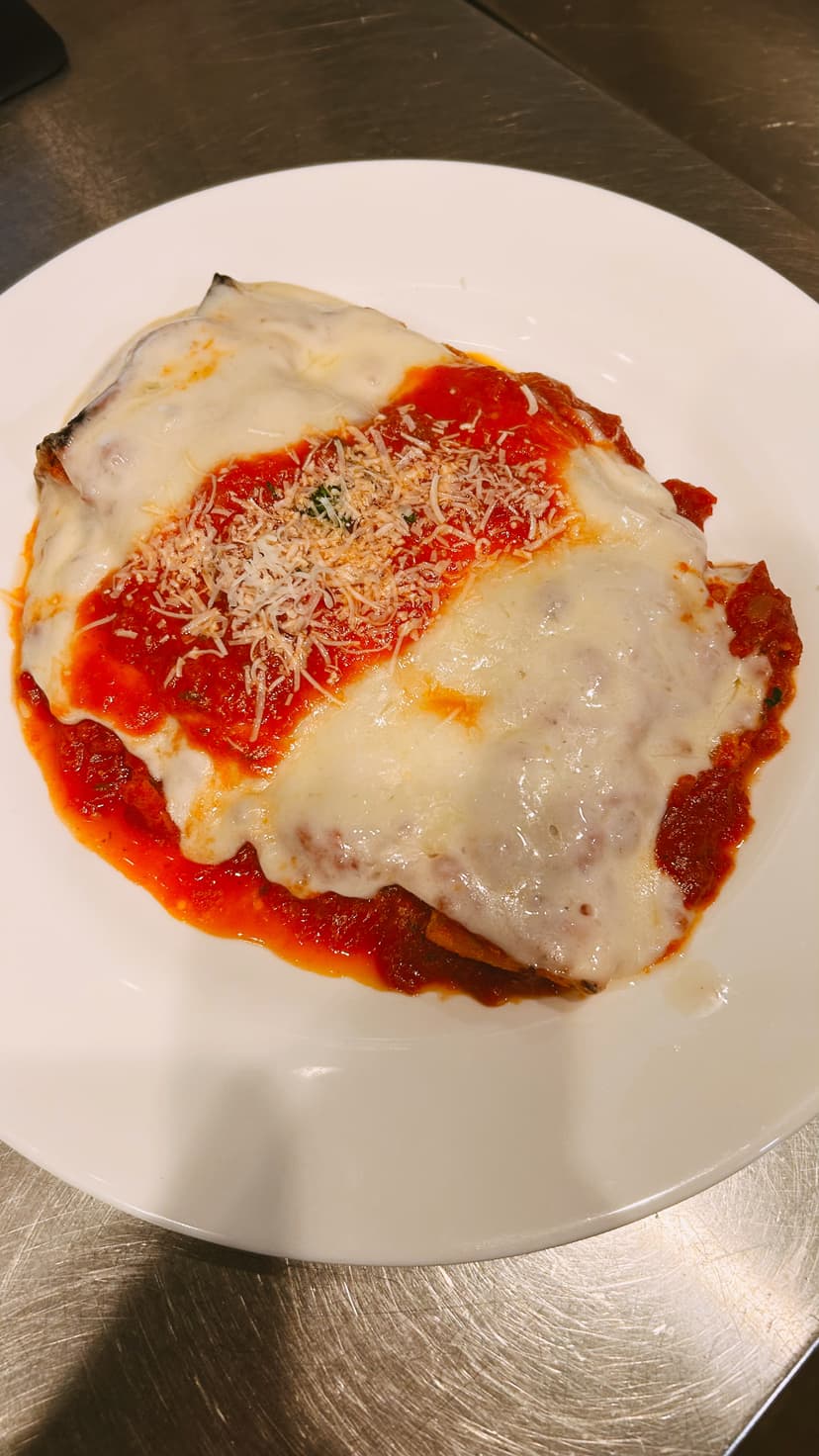 Traditional Italian cooking methods being demonstrated at Mama Mia's authentic kitchen