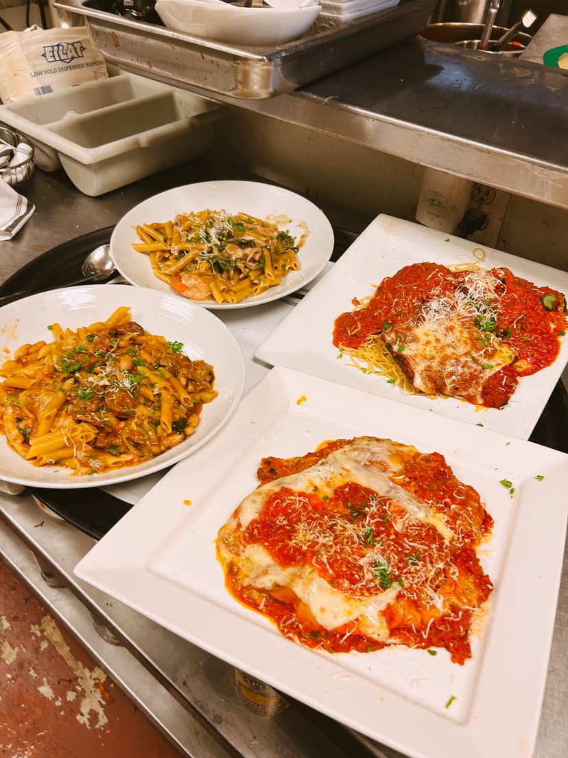 Customers enjoying their Italian meal in the dining room at Mama Mia's restaurant