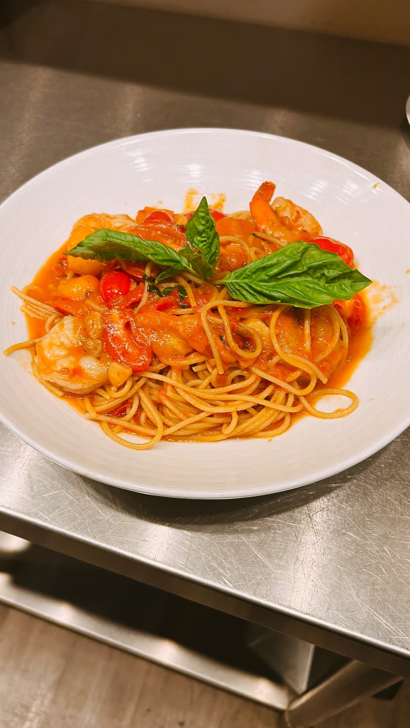 Traditional Italian pizza from wood-fired oven with fresh toppings at Mama Mia's