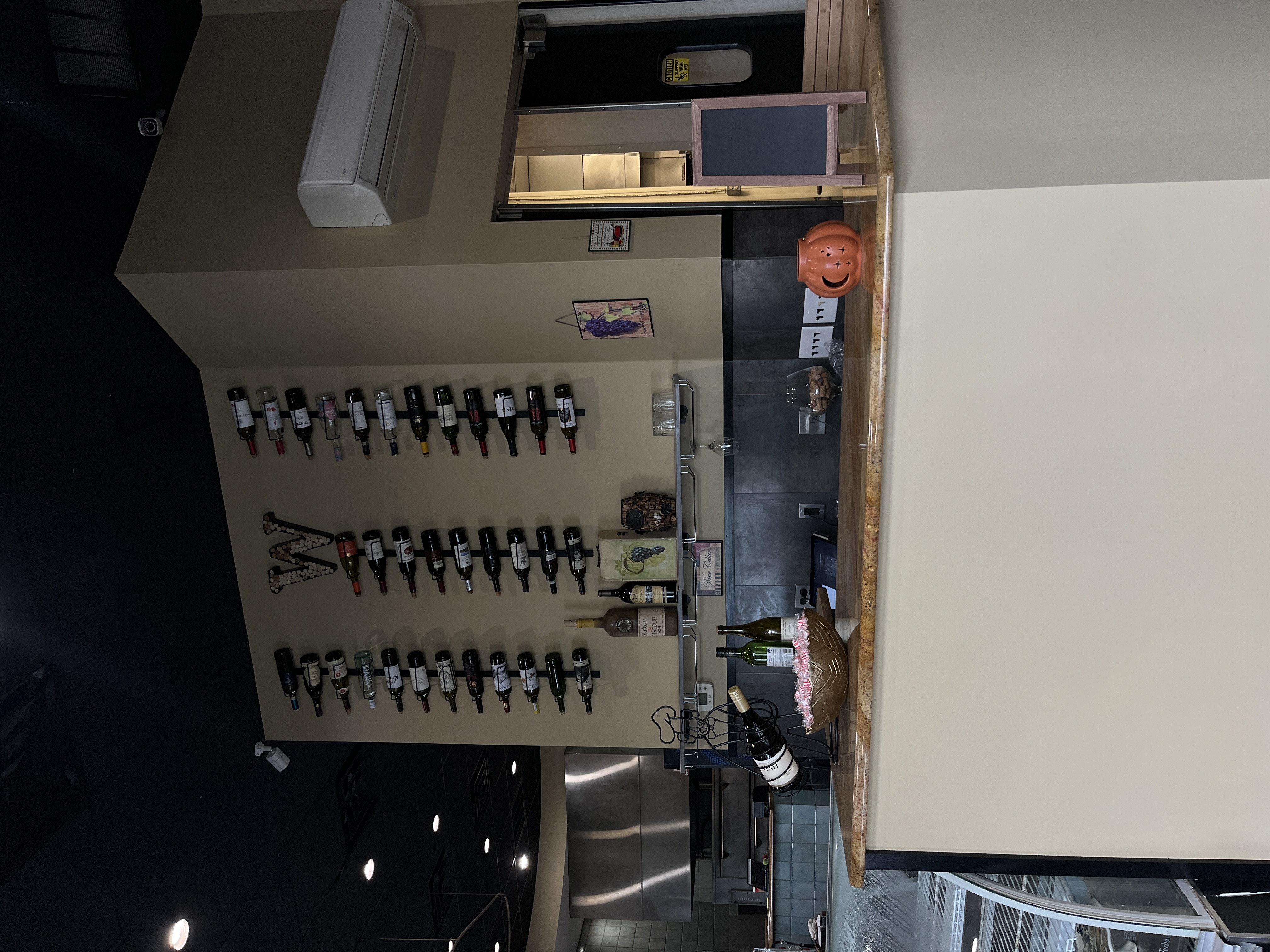 Newly renovated elegant dining room at Mama Mia's Italian Restaurant in Egg Harbor Township NJ with modern pendant lighting and beautiful Italian coastal artwork