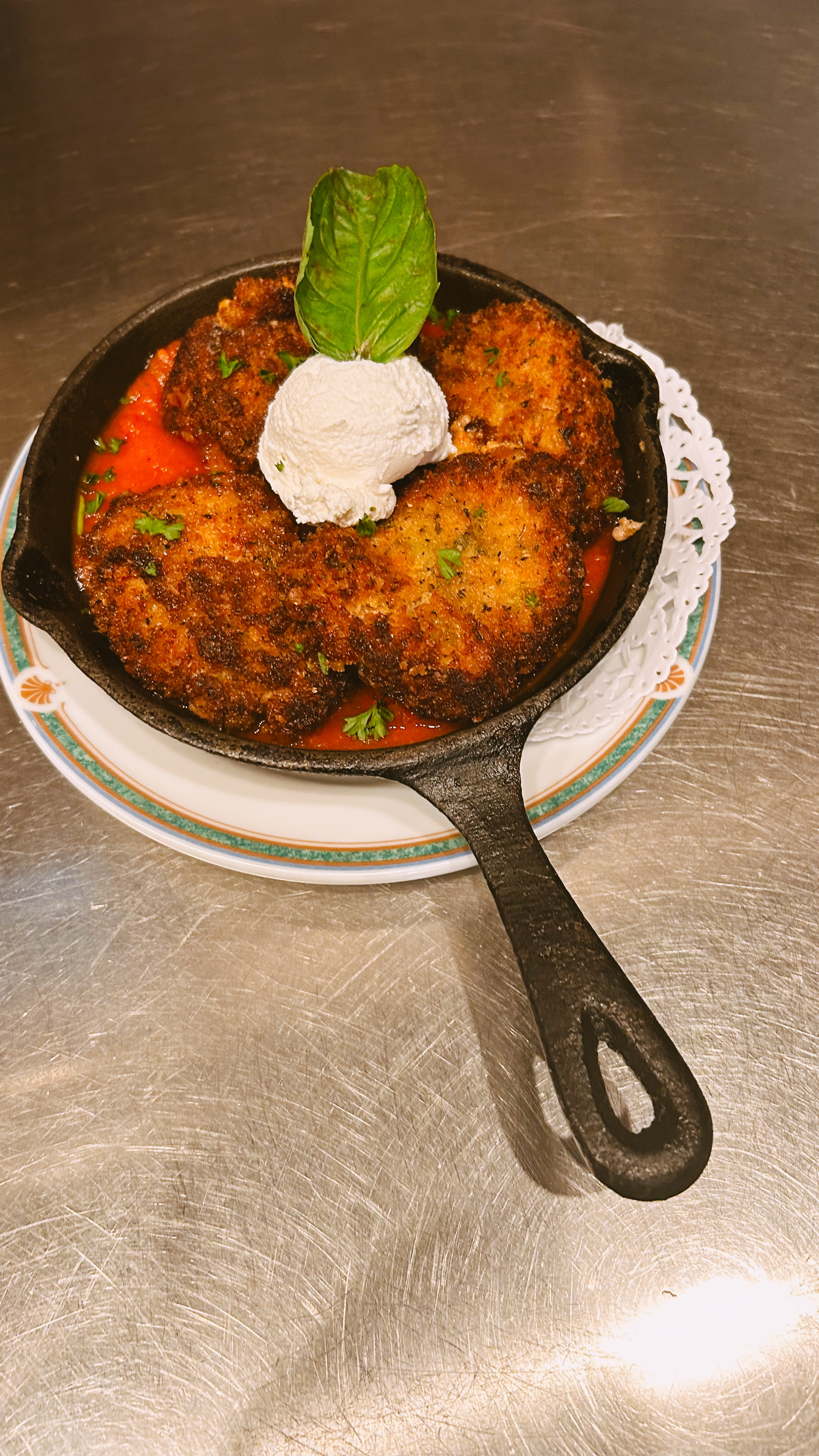 Close-up of freshly prepared Italian cuisine at Mama Mia's restaurant featuring traditional Italian cooking techniques and presentation